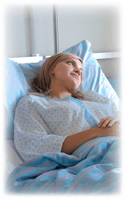 blonde woman in hospital bed recovery
