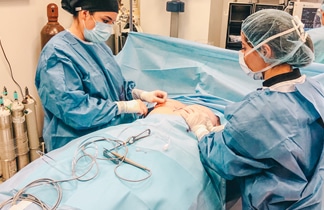 SixSurgery two female surgeons operating